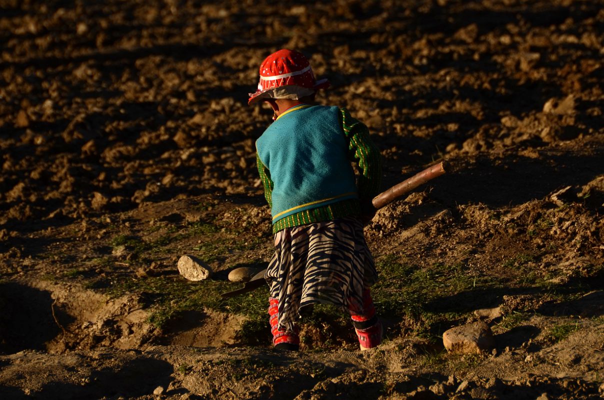 15 Child In Colourful Clothing Tilling The Field At Sunset In Yilik Village On The Way To K2 China Trek